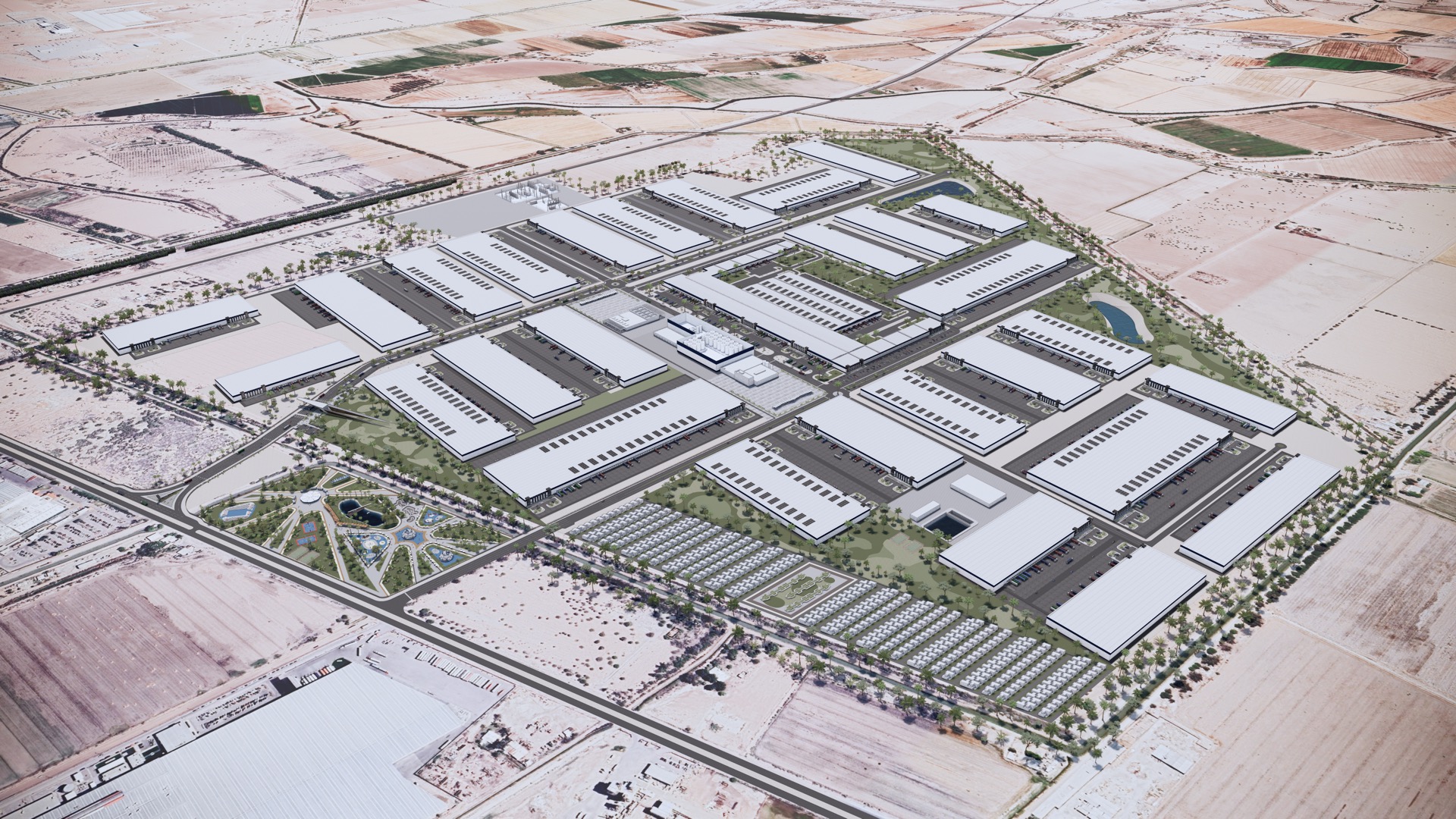 Visualización aérea de un parque industrial ordenado junto a un parque con andadores, estanques y arbolado, en un paisaje árido.